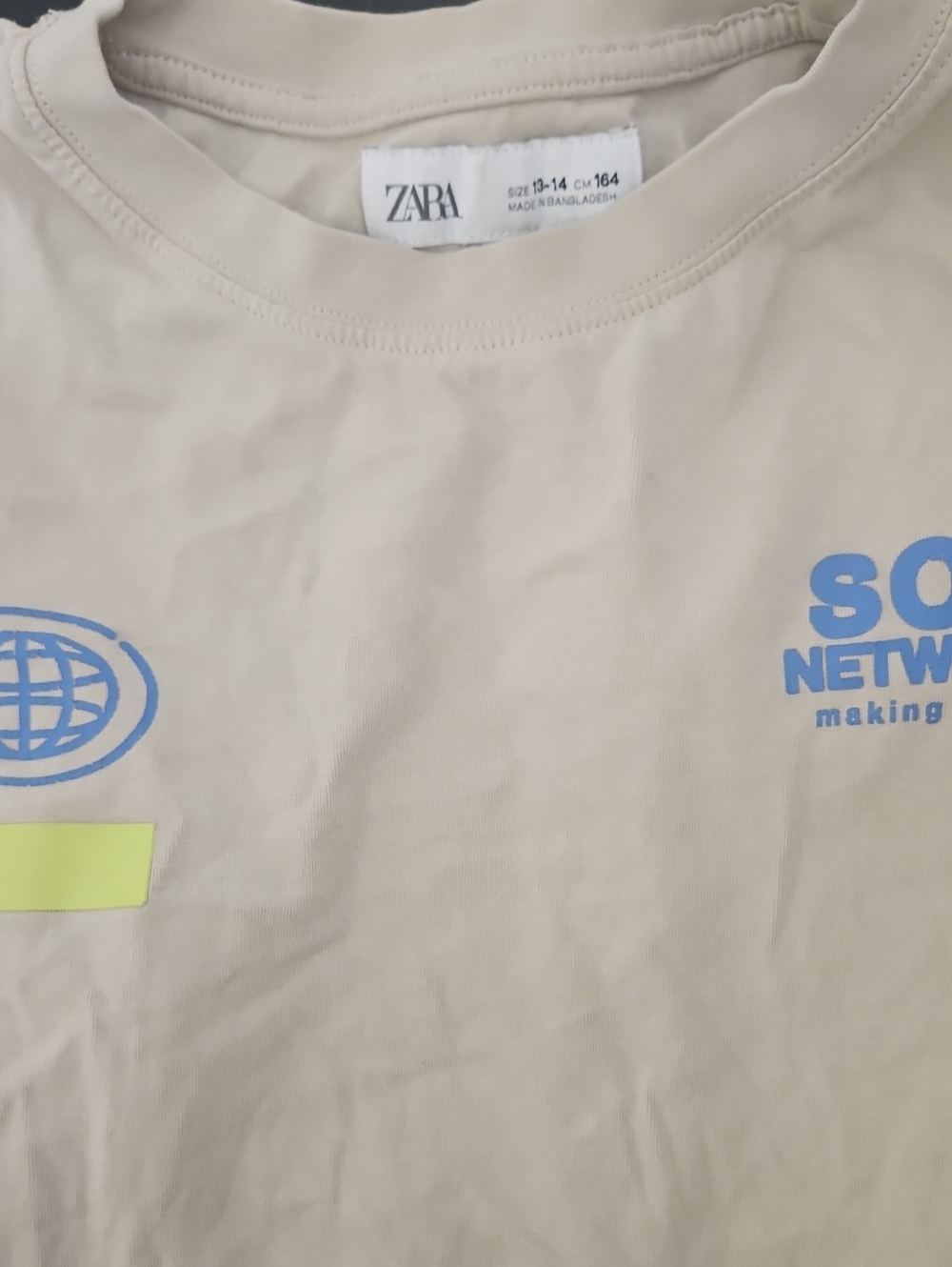 ZARA Beige Short-Sleeve Tee with Blue Graphic Accents
